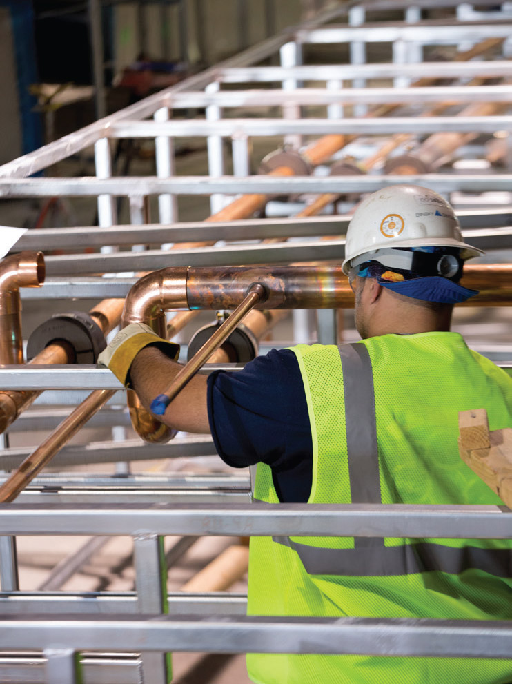 Plumber with copper pipes